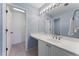 Bathroom with a long white countertop, white cabinets and light blue walls at 700 Clubside Dr, Roswell, GA 30076