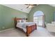 Bedroom with high ceilings, arched window, and an updated ceiling fan at 700 Clubside Dr, Roswell, GA 30076