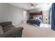 Bedroom featuring bunk beds, a ceiling fan, with an adjacent sitting area and en suite bathroom at 700 Clubside Dr, Roswell, GA 30076