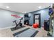 Exercise room with work out equipment including a bike and free weights at 700 Clubside Dr, Roswell, GA 30076