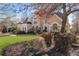 Inviting exterior view of a home featuring mature trees and beautiful landscaping around the property at 700 Clubside Dr, Roswell, GA 30076