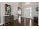 Elegant foyer featuring hardwood floors, a tall ceiling, and a decorative cabinet at 700 Clubside Dr, Roswell, GA 30076