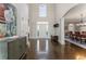 Bright foyer with beautiful hardwood floors and views into the dining room and front door at 700 Clubside Dr, Roswell, GA 30076