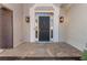 Elegant front door with sidelights and decorative hardware set in a stone entry at 700 Clubside Dr, Roswell, GA 30076