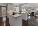 Modern kitchen with white cabinets, center island, and open layout at 700 Clubside Dr, Roswell, GA 30076