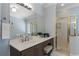 Main bathroom with granite countertop vanity, stand up shower, and large mirror at 700 Clubside Dr, Roswell, GA 30076