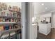 Well-stocked pantry with organized shelving and clear containers next to the kitchen with white cabinetry at 700 Clubside Dr, Roswell, GA 30076