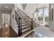 Grand staircase leading to a bright and open living space at 700 Clubside Dr, Roswell, GA 30076