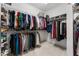 Large walk-in closet featuring extensive shelving and plenty of room for storage at 700 Clubside Dr, Roswell, GA 30076