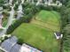 Aerial view showcasing the large green common space and neighborhood pool at 1976 Hedge Brooke Nw Trl, Acworth, GA 30101