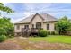 Backyard features a home exterior, a wooden deck, and lush green grass at 1976 Hedge Brooke Nw Trl, Acworth, GA 30101