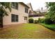 A backyard with lush grass, a wooded fence, and home exterior at 1976 Hedge Brooke Nw Trl, Acworth, GA 30101