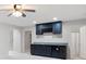 Basement bar area with dark cabinets, granite countertop, and wine rack at 1976 Hedge Brooke Nw Trl, Acworth, GA 30101