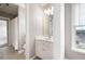 Bathroom features a white vanity, tile floor, and natural light at 1976 Hedge Brooke Nw Trl, Acworth, GA 30101