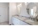 Bathroom with granite counters, double sink vanity, tile floor, and unique mirrors at 1976 Hedge Brooke Nw Trl, Acworth, GA 30101