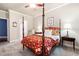 Bright bedroom featuring a four-poster bed, ceiling fan, and carpeted floors at 1976 Hedge Brooke Nw Trl, Acworth, GA 30101