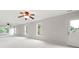 Expansive bonus room with neutral walls, carpet, multiple windows, and door at 1976 Hedge Brooke Nw Trl, Acworth, GA 30101