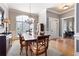 Formal dining room with chandelier, large window, and classic details at 1976 Hedge Brooke Nw Trl, Acworth, GA 30101