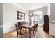 Dining room with large window, chandelier, and traditional furnishings at 1976 Hedge Brooke Nw Trl, Acworth, GA 30101