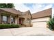 Spacious driveway leading to a well-maintained home with a two-car garage at 1976 Hedge Brooke Nw Trl, Acworth, GA 30101