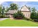 Beautiful stone-accented home with manicured lawn and charming curb appeal at 1976 Hedge Brooke Nw Trl, Acworth, GA 30101