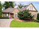 Charming stone-and-shingle home with landscaped front yard and inviting curved driveway at 1976 Hedge Brooke Nw Trl, Acworth, GA 30101