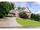 Attractive single-Gathering home featuring a long driveway and lush landscaping at 1976 Hedge Brooke Nw Trl, Acworth, GA 30101