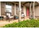 Cozy front porch with seating, offering a welcoming entrance to the home at 1976 Hedge Brooke Nw Trl, Acworth, GA 30101