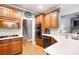 Stylish kitchen featuring wooden cabinets, white countertops, stainless steel appliances, and modern fixtures at 1976 Hedge Brooke Nw Trl, Acworth, GA 30101