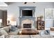 Comfortable living room featuring stone fireplace and plush seating perfect for relaxation at 1976 Hedge Brooke Nw Trl, Acworth, GA 30101