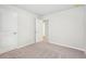 View of a bedroom with neutral carpet and white doors at 3001 Viewpark Cir, Conyers, GA 30013