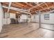 Unfinished basement featuring exposed beams and sleek, light-colored flooring at 3409 Glensford Dr, Decatur, GA 30032