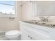 Bathroom featuring a granite vanity, modern toilet and attractive fixtures at 3409 Glensford Dr, Decatur, GA 30032