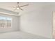 Bedroom featuring a tray ceiling, ceiling fan, and a window with a view of trees at 162 Spaulding Ln, Woodstock, GA 30188