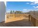 Wooden deck offering a serene outdoor space with views of the surrounding trees and skyline at 162 Spaulding Ln, Woodstock, GA 30188