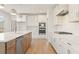 Modern kitchen featuring stainless steel appliances, an island, and plenty of storage at 162 Spaulding Ln, Woodstock, GA 30188