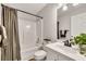 Bathroom offers a tub-shower combination, a vanity with ample countertop space, and modern fixtures at 3031 Clove Tree Ln, Woodstock, GA 30189