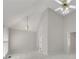 Bedroom with light-colored carpet, chandelier, vaulted ceiling and private entry at 3031 Clove Tree Ln, Woodstock, GA 30189