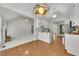 Open kitchen layout boasts hardwood floors and seamlessly connects to the living area at 3031 Clove Tree Ln, Woodstock, GA 30189