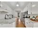 Modern kitchen with white cabinets, granite countertops, and stainless steel appliances at 3031 Clove Tree Ln, Woodstock, GA 30189