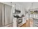 Well-equipped kitchen features stainless steel appliances and ample counter space at 3031 Clove Tree Ln, Woodstock, GA 30189