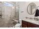 Modern bathroom with tiled shower, glass door, granite vanity, and stylish fixtures at 3845 Williams Point Dr, Cumming, GA 30028