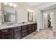 Bathroom with granite countertops, double sinks, and large mirrors at 3845 Williams Point Dr, Cumming, GA 30028