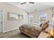 Bedroom with neutral colors and an oversized mirror that reflects light and space at 3845 Williams Point Dr, Cumming, GA 30028