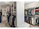 Walk-in closet featuring custom shelving and ample storage space at 3845 Williams Point Dr, Cumming, GA 30028