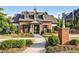 The Retreat clubhouse with outdoor seating, brick details and manicured landscaping at 3845 Williams Point Dr, Cumming, GA 30028