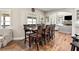 Bright dining area features a wooden table and chairs and is naturally lit by a large window at 3845 Williams Point Dr, Cumming, GA 30028