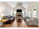 Spacious living room with vaulted ceiling, stone fireplace, and large windows that let in lots of natural light at 3845 Williams Point Dr, Cumming, GA 30028