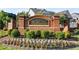 Williams Point neighborhood entrance sign featuring manicured landscaping and flowering plants at 3845 Williams Point Dr, Cumming, GA 30028