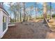 A large backyard with mature trees and a gentle slope, offering plenty of room for outdoor activities at 4506 Reva Ne Way, Marietta, GA 30066